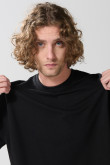 Buzo cuello redondo unicolor oversize con manga larga