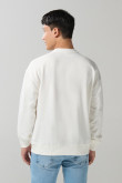 Buzo cuello redondo unicolor oversize con manga larga