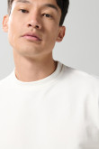 Buzo cuello redondo unicolor oversize con manga larga