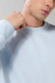 Buzo cuello redondo unicolor oversize con manga larga