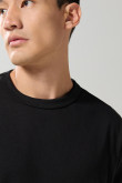 Camiseta oversize unicolor cuello redondo en algodón