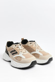 Tenis chunky deportivos en color gris y beige.