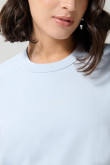 Camiseta unicolor crop top con texto minimalista