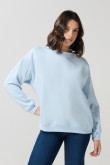 Buzo oversize unicolor cuello redondo con manga larga