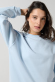 Buzo oversize unicolor cuello redondo con manga larga
