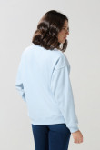 Buzo oversize unicolor cuello redondo con manga larga