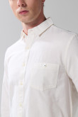 Camisa manga larga unicolor en algodón con bolsillo