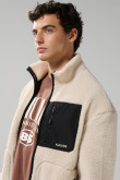 Chaqueta sherpa unicolor con bolsillos y cuello alto