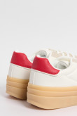 Tenis cremas claros de plataforma con contrastes rojos