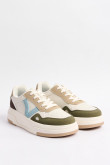Tenis de plataforma en color crema claro con contraste verde y azul.