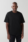Camiseta unicolor cuello redondo oversize con hombro caído
