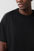 Camiseta unicolor cuello redondo oversize con hombro caído