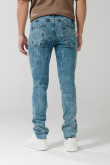 Jean slim azul con diseños localizados y tiro bajo