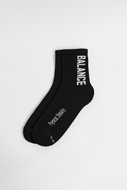 Medias largas unicolores con texturas y diseño lateral