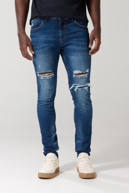 Jean skinny tiro bajo azul con desgastes y rotos
