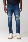 Jean skinny tiro bajo azul con desgastes y rotos