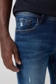 Jean skinny tiro bajo azul con desgastes y rotos