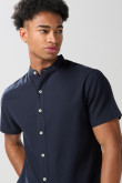 Camisa cuello nerú unicolor con botones en frente