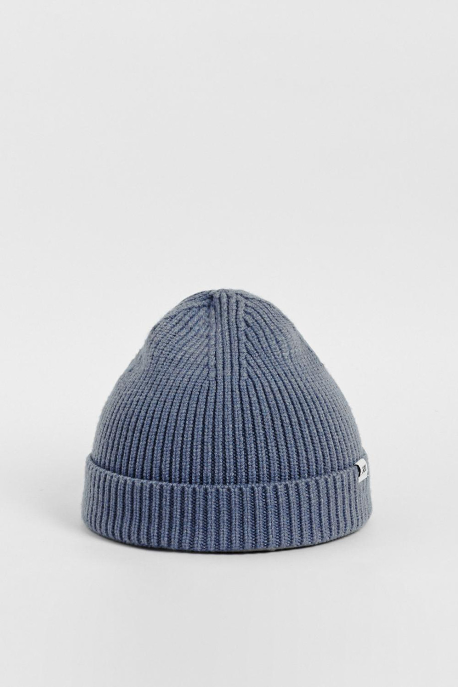 Gorro unicolor tejido con texto en marquilla