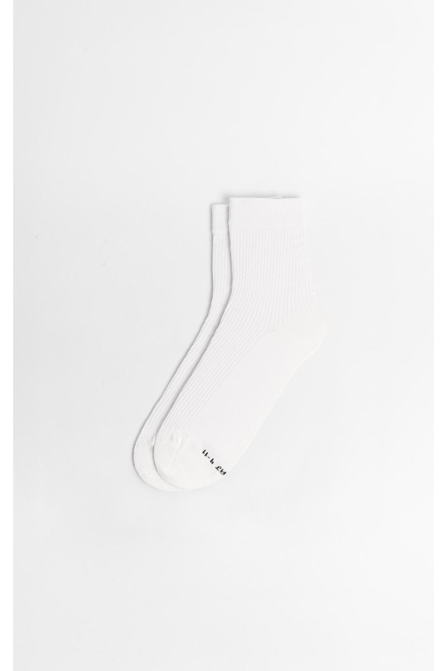 Medias largas unicolores con finas texturas de canal