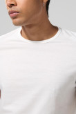 Camiseta unicolor ajustada con cuello redondo y puños en rib