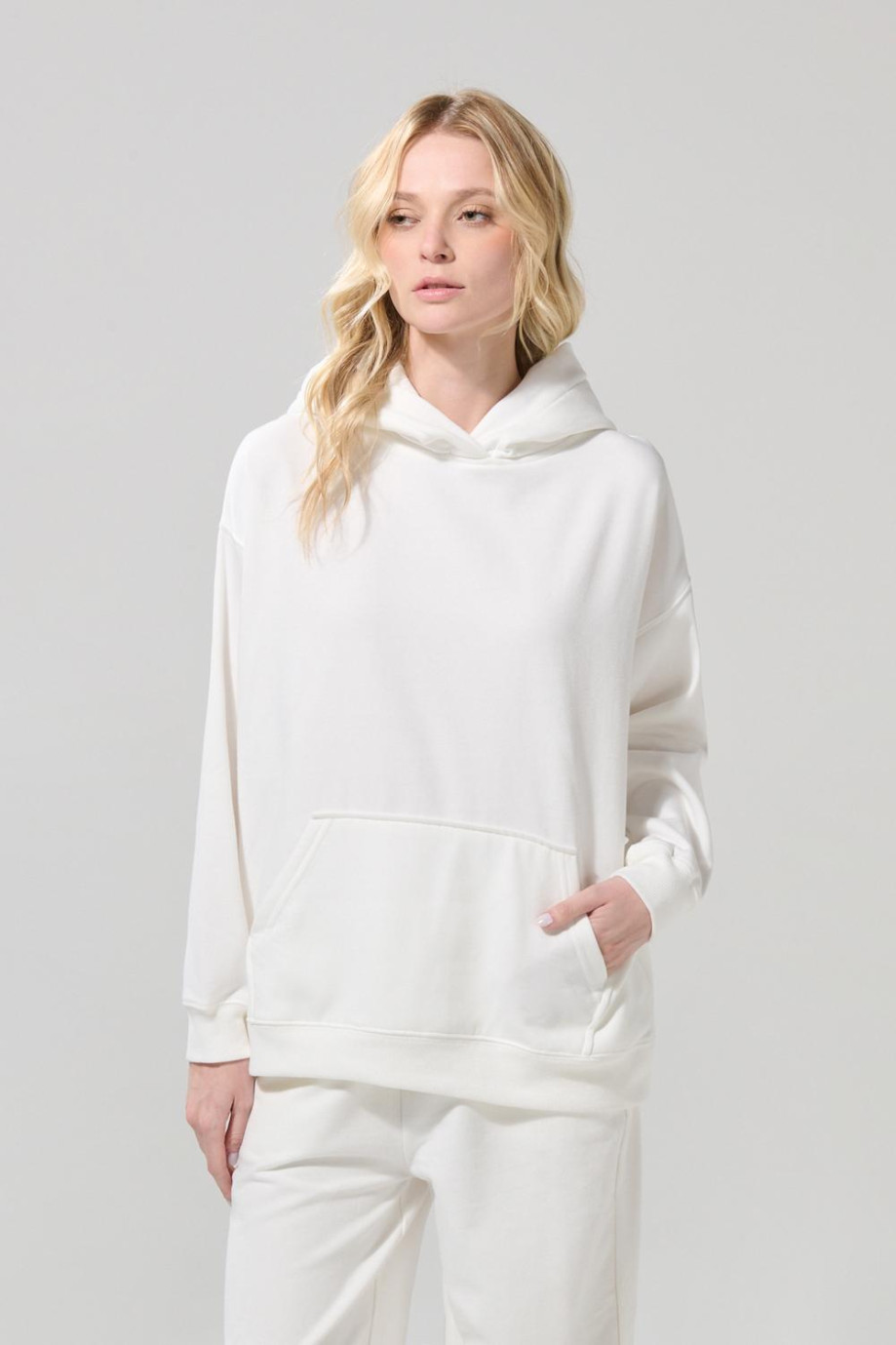 Buzo oversize en tela perchada unicolor con capota