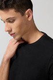 Camiseta unicolor cuello redondo ajustada en algodón
