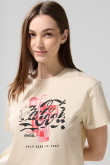 Camiseta crop top kaki clara con estampado de Coca-Cola