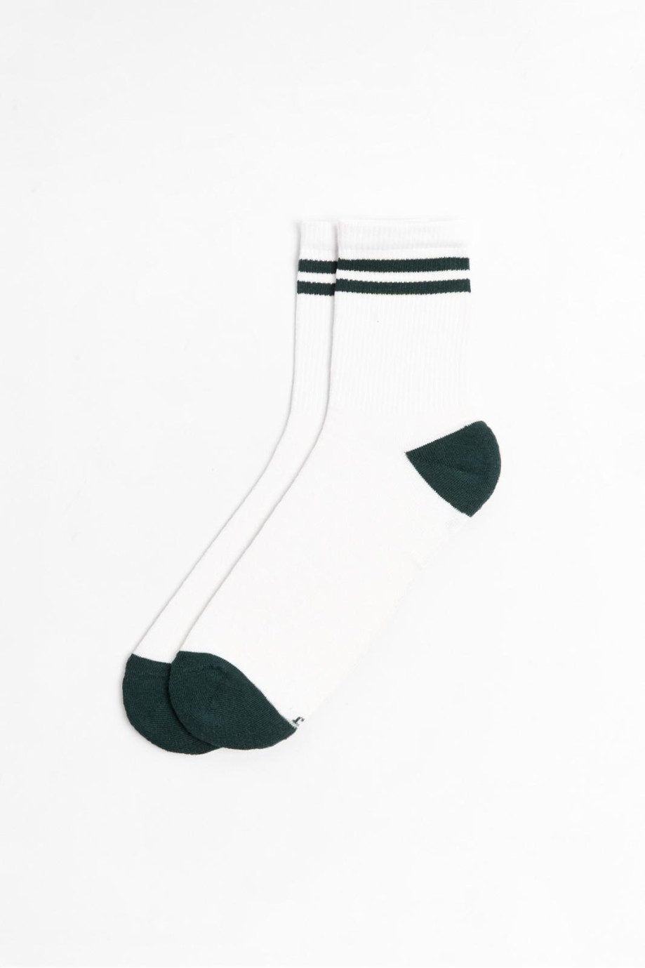 Medias largas unicolores con rayas superiores en contraste