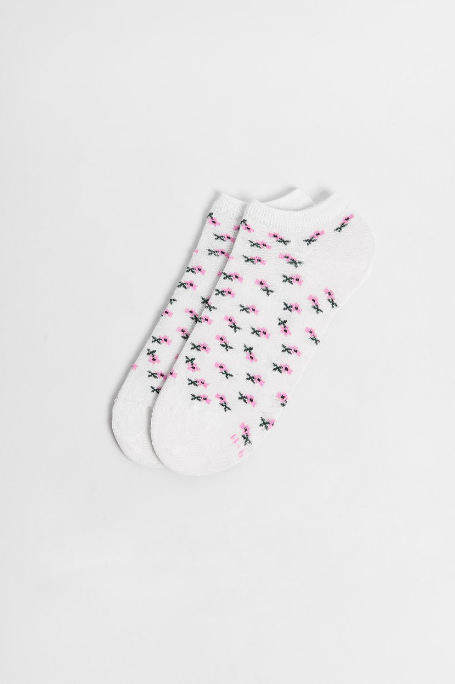 Medias tobilleras unicolores con artes continuos de flores