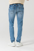 Jean tiro bajo skinny azul medio con desgastes y bolsillos