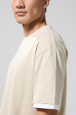Camiseta oversize cuello redondo unicolor con contrastes