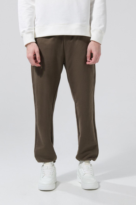 Pantalón unicolor jogger con bolsillos y elásticos