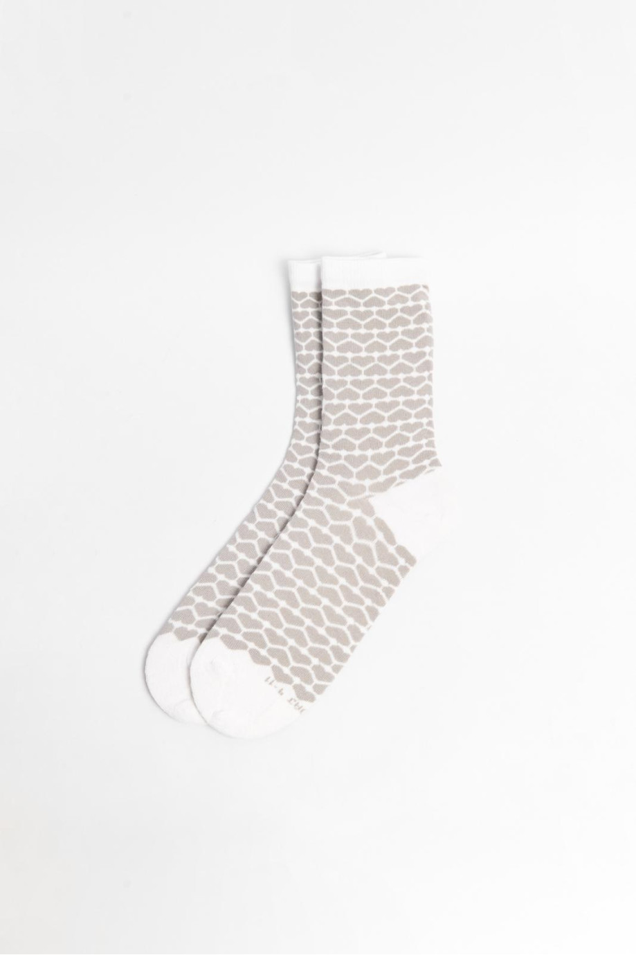 Medias unicolores largas con diseños de corazones