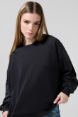 Buzo oversize cuello redondo unicolor con manga ranglan