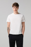 Camiseta cuello redondo unicolor con doblez en puños
