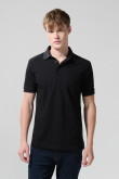 Camiseta unicolor tipo polo con manga corta y botones