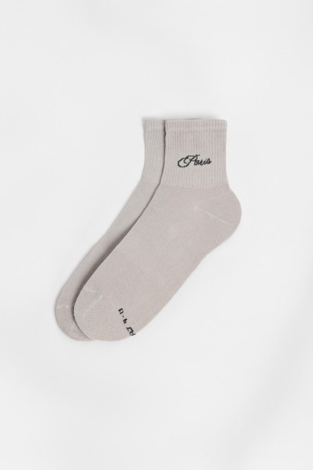 Medias cortas unicolores con texto college en costado