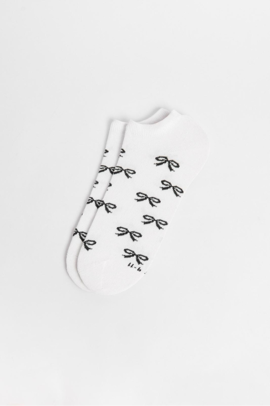 Medias unicolores tobilleras con diseño de moños