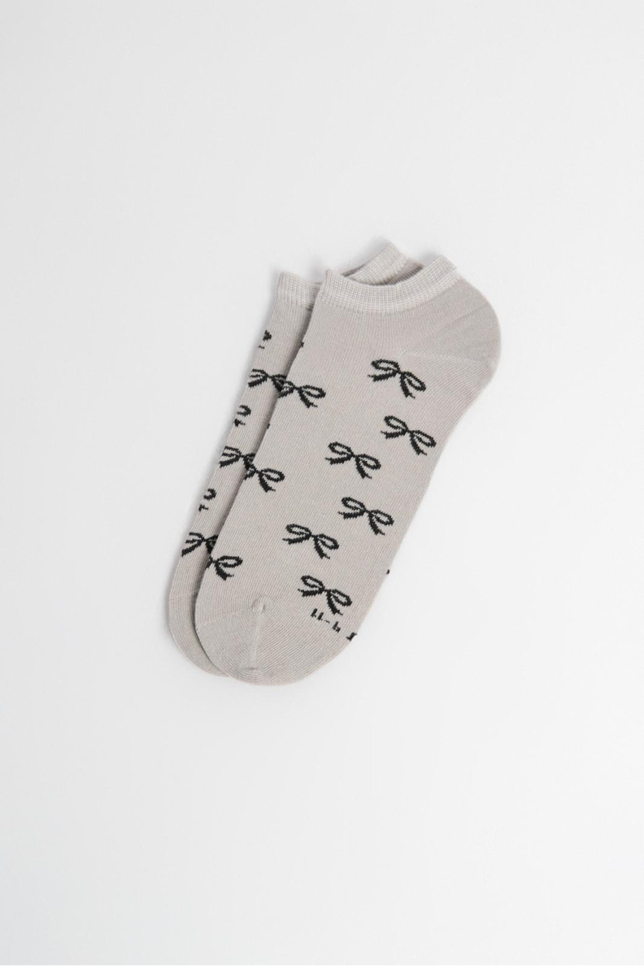 Medias unicolores tobilleras con diseño de moños