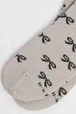 Medias unicolores tobilleras con diseño de moños