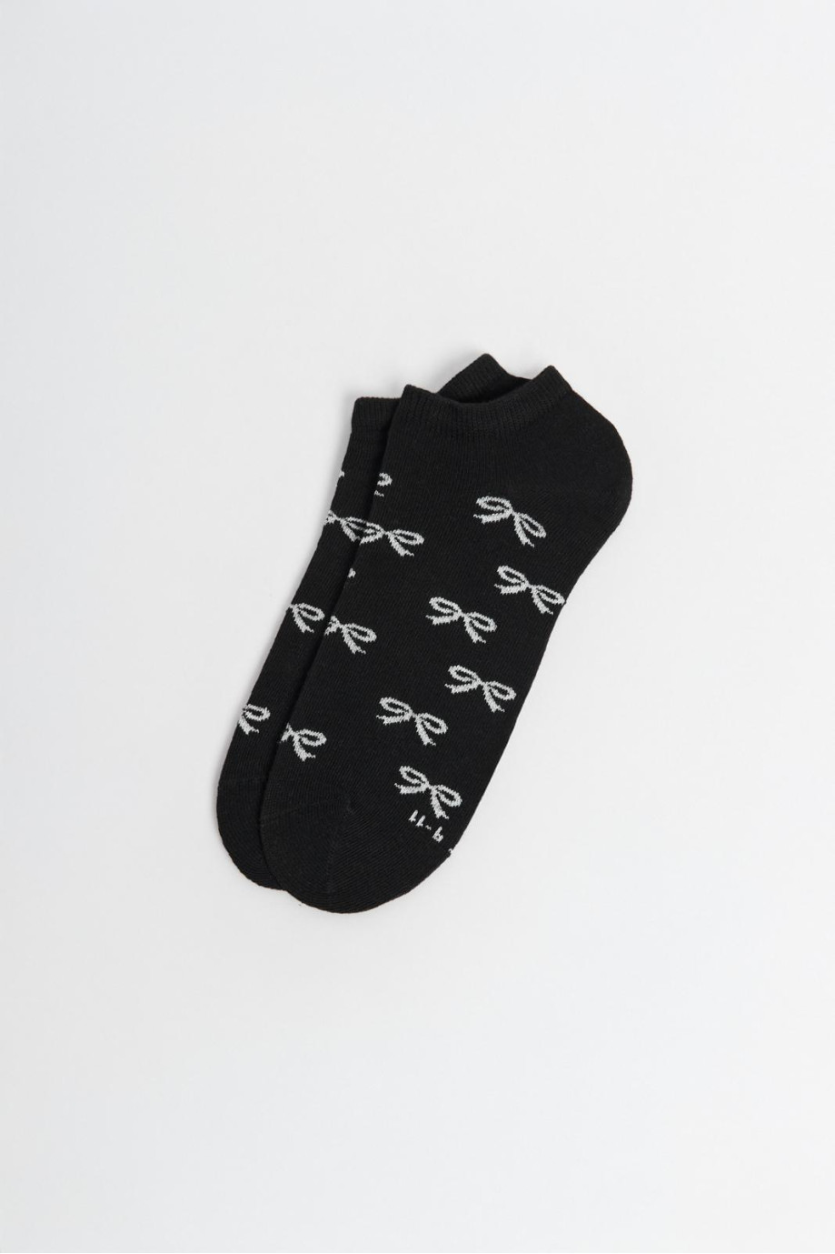 Medias unicolores tobilleras con diseño de moños