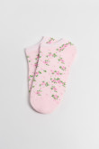 Medias unicolores tobilleras con diseño de flores.