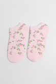 Medias unicolores tobilleras con diseño de flores.