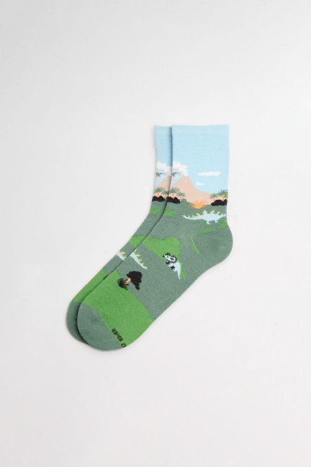 Medias unicolores largas con diseños de dinosaurios.
