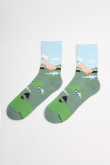 Medias unicolores largas con diseños de dinosaurios.