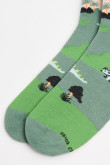 Medias unicolores largas con diseños de dinosaurios.