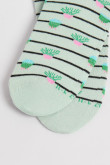 Medias unicolores tobilleras con diseño de plantas.