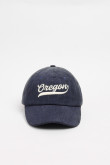 Gorra de beisbolera color kaki y azul con bordado 3D.