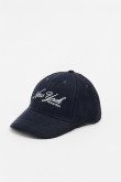 Gorra beisbolera en color azul, con refuerzo, cierre plástico y aplique bordado "New York".